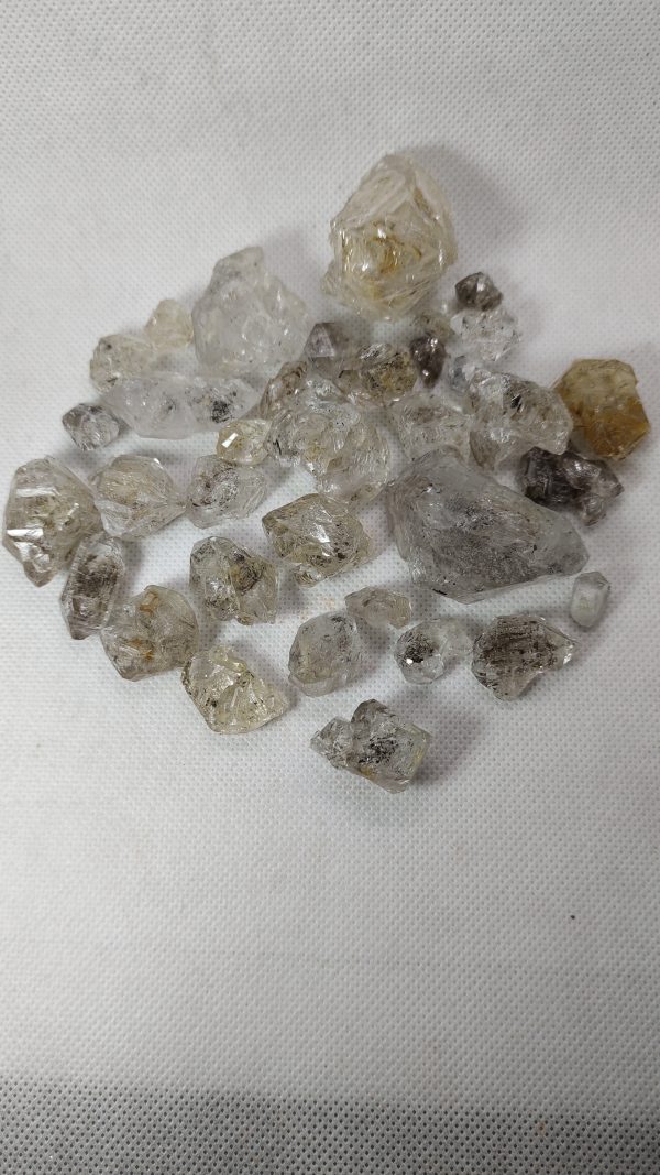 Mix assorted sizes and shapes of petroleum, window and quartz